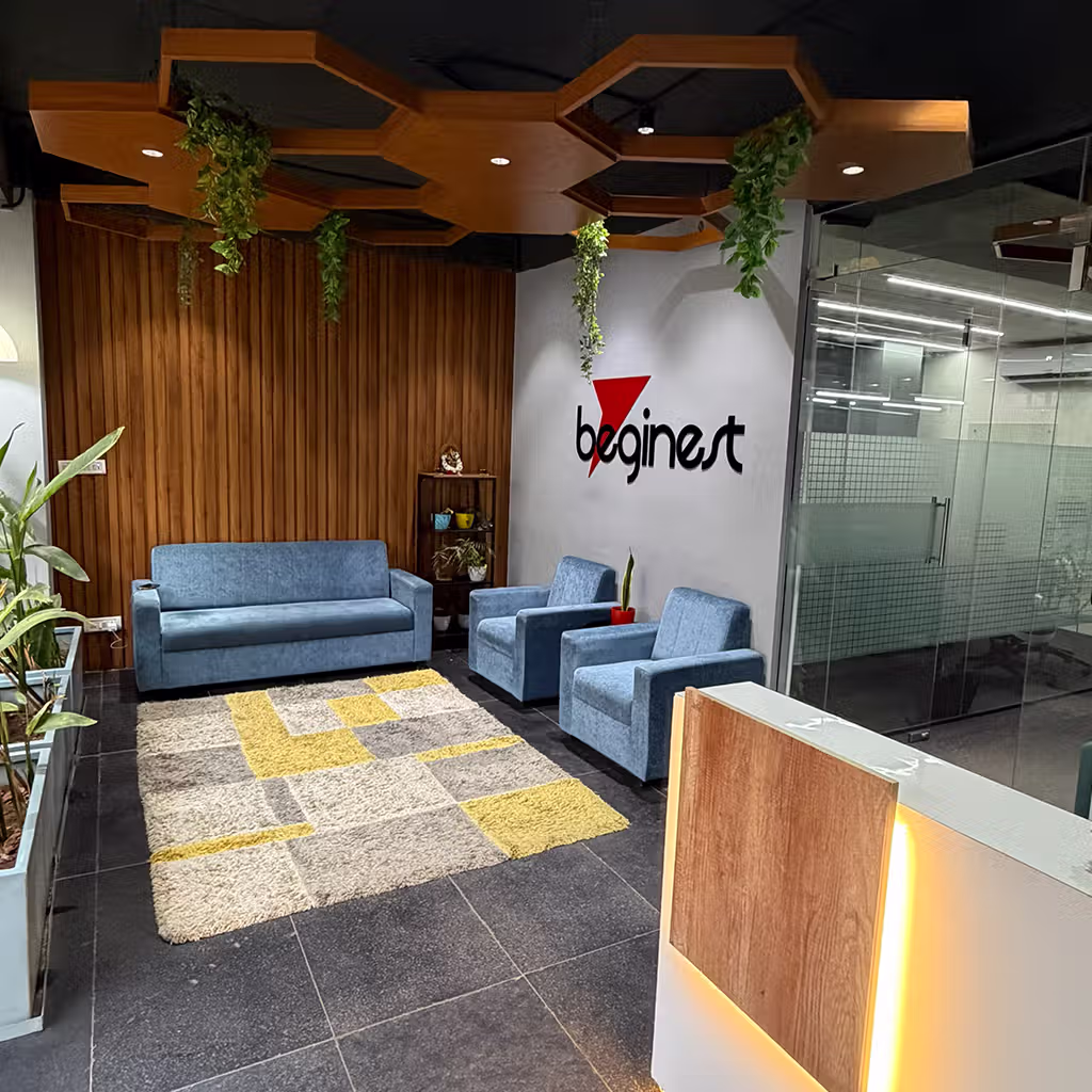 Person is working sitting on sofa surrounded by greenery in coworking space